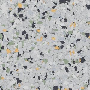 Epoxy flooring flake blend with light gray, charcoal, muted green, and tan flecks on a light gray base.
