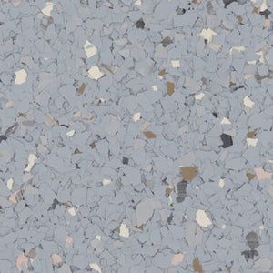 A light grey floor coating with a multi-colored, speckled flake texture.
