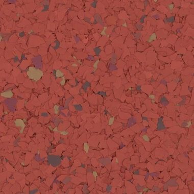 Red flooring material with a textured, multi-colored speckled pattern of small, irregularly shaped flakes.