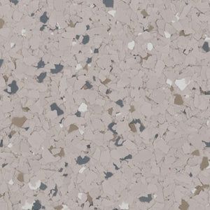 A textured surface featuring a mix of light tan, dark gray, white, and brown flecks in a speckled, stone-like pattern.