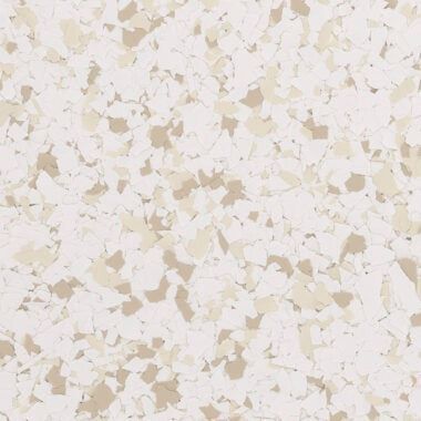 A close-up of speckled flooring material featuring a blend of white, cream, and beige chips.