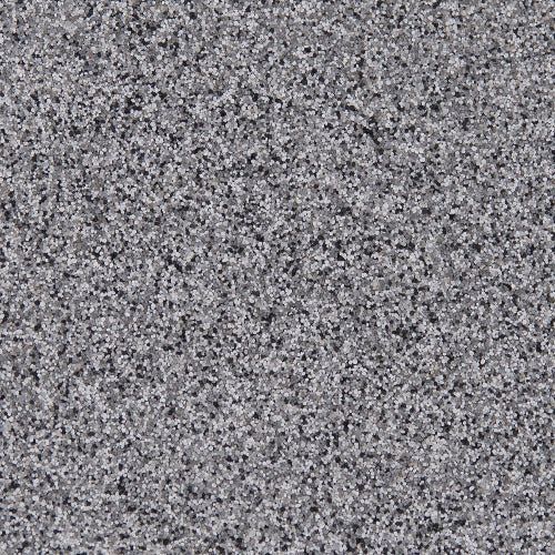 A close-up of a speckled, gray granite surface with a fine, uniform texture of light and dark mineral grains.