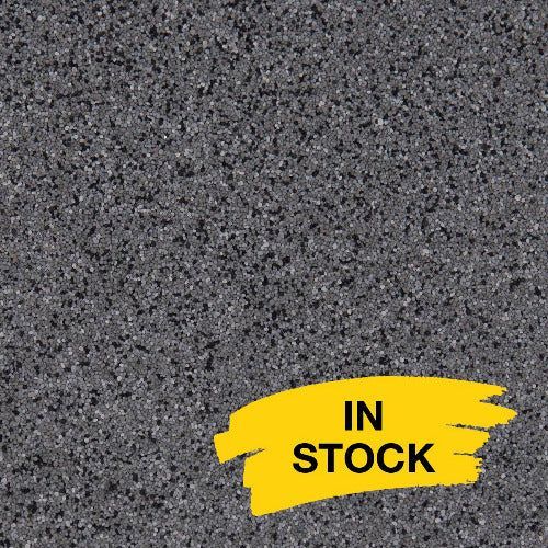 A dark gray, fine-grained stone texture with a yellow 