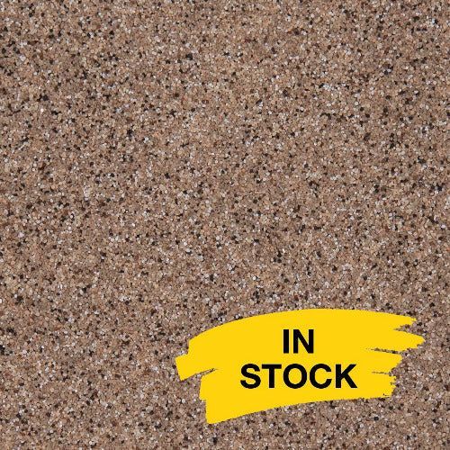 A sample of brown, speckled granite surface with a yellow 