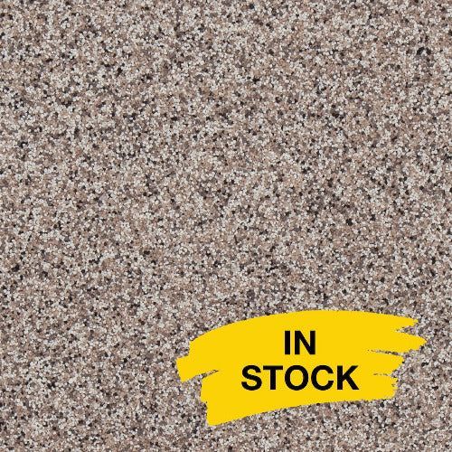 Tan and brown speckled granite texture with a yellow 