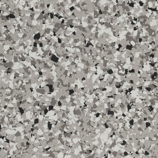 A seamless texture of small, multi-shaped flecks in shades of light gray, charcoal, and black on a neutral background.