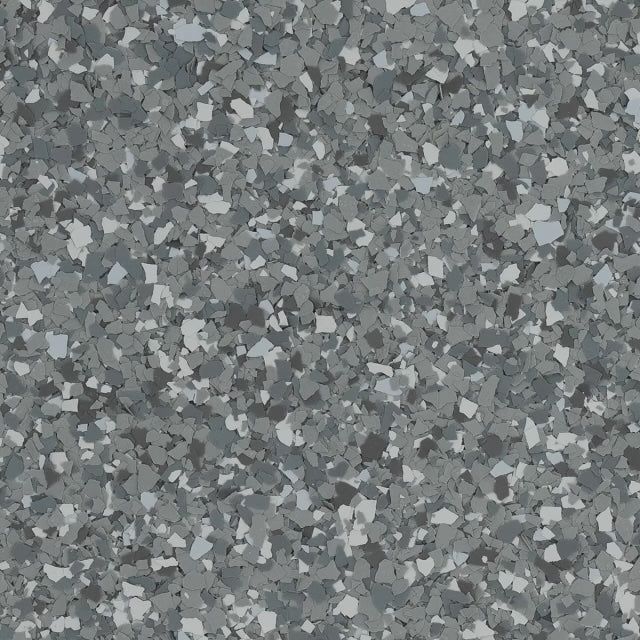 A close-up of a seamless grey floor coating with a speckled, multi-tone grey and white flake pattern.