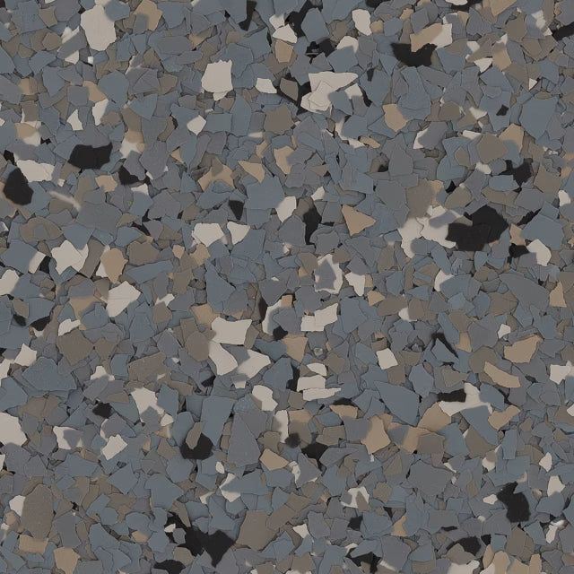 A multi-colored epoxy floor flake blend featuring flecks of blue-gray, light tan, black, and off-white.