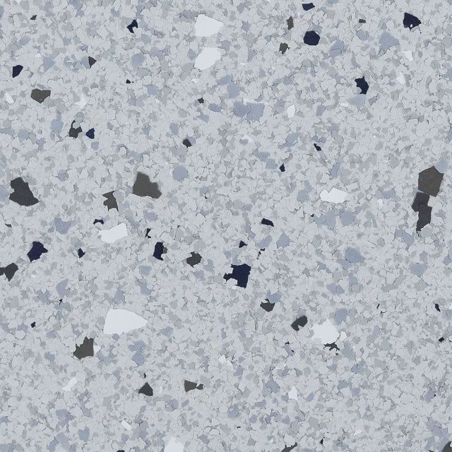 A light gray speckled floor texture with scattered dark gray, white, and blue-gray flakes.