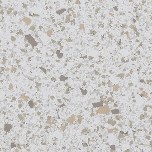 A close-up of a speckled, light gray surface with flecks of tan, white, and dark gray, resembling terrazzo or granite.