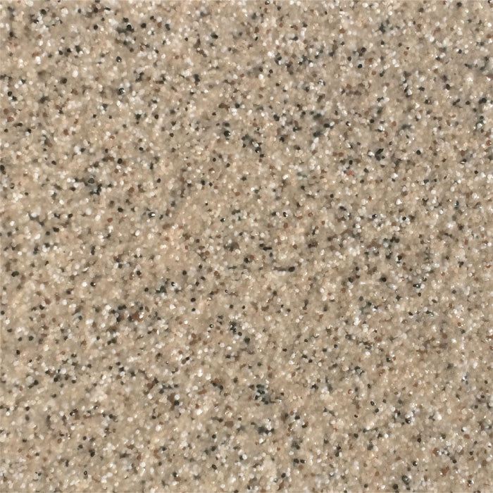 A close-up texture of beige granite with small, scattered black and white flecks.