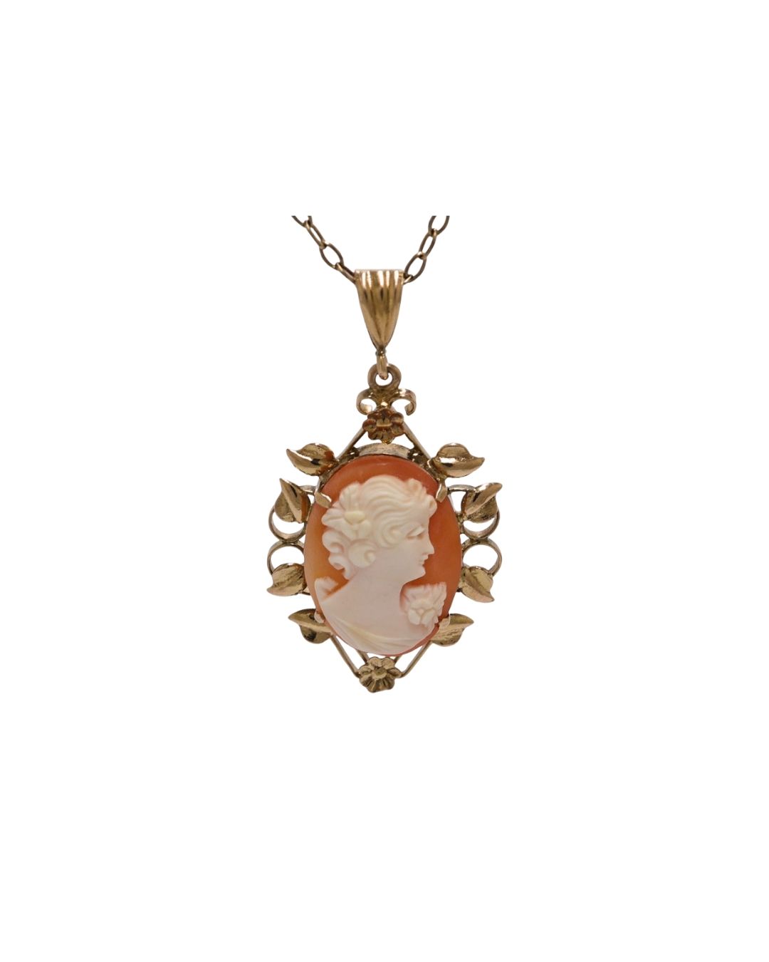 A gold bar brooch featuring a central oval shell cameo of a profile portrait, attached to a safety pin by a thin chain.