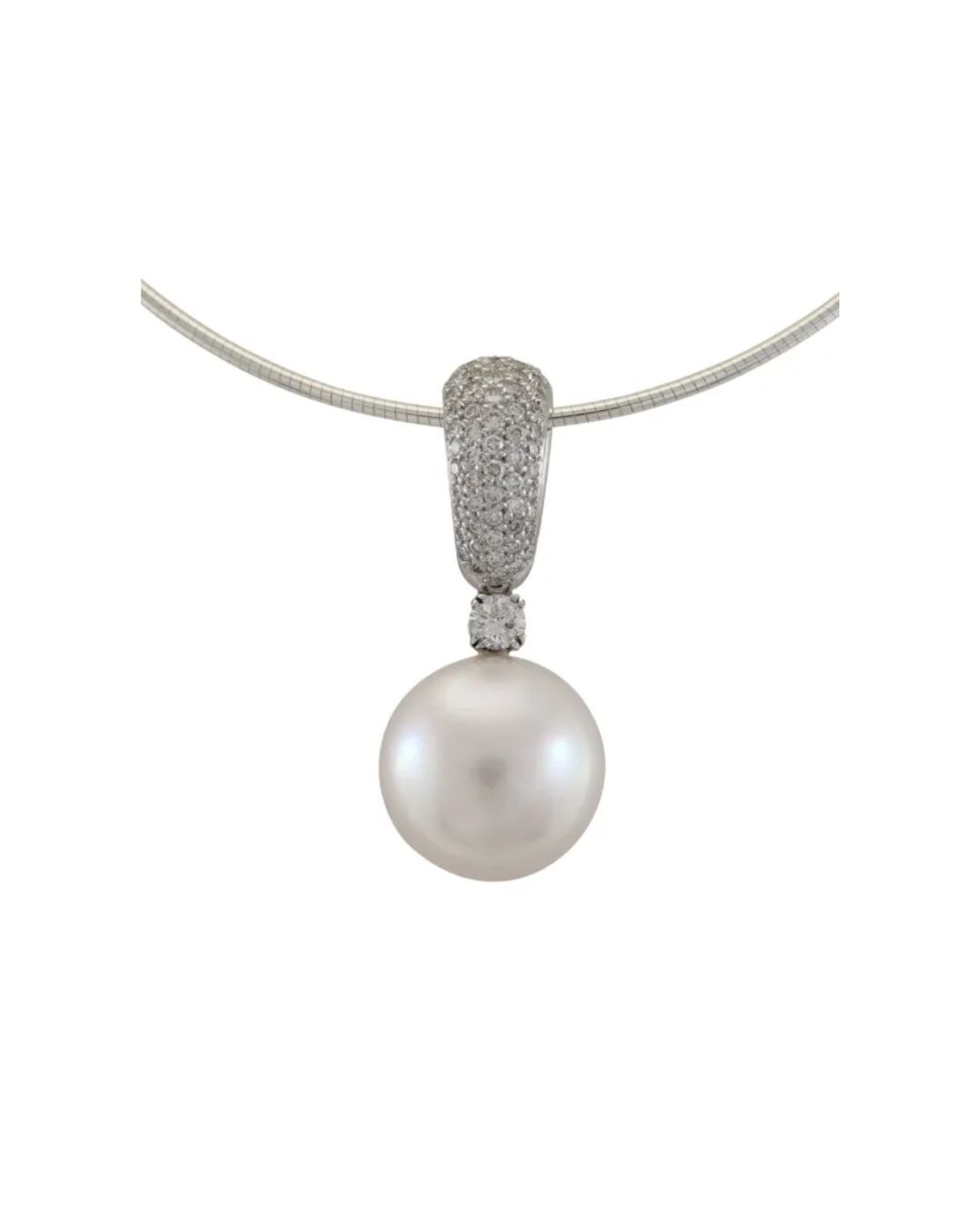 A white pearl pendant on a silver-toned necklace, featuring a diamond-encrusted bail and a single round accent diamond.
