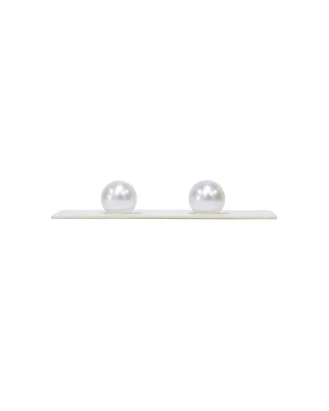 Two round, white pearl stud earrings on a white display card against a plain white background.