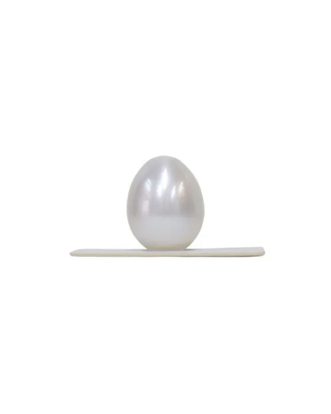 A white, egg-shaped object sits vertically on a thin, white rectangular base against a plain white background.