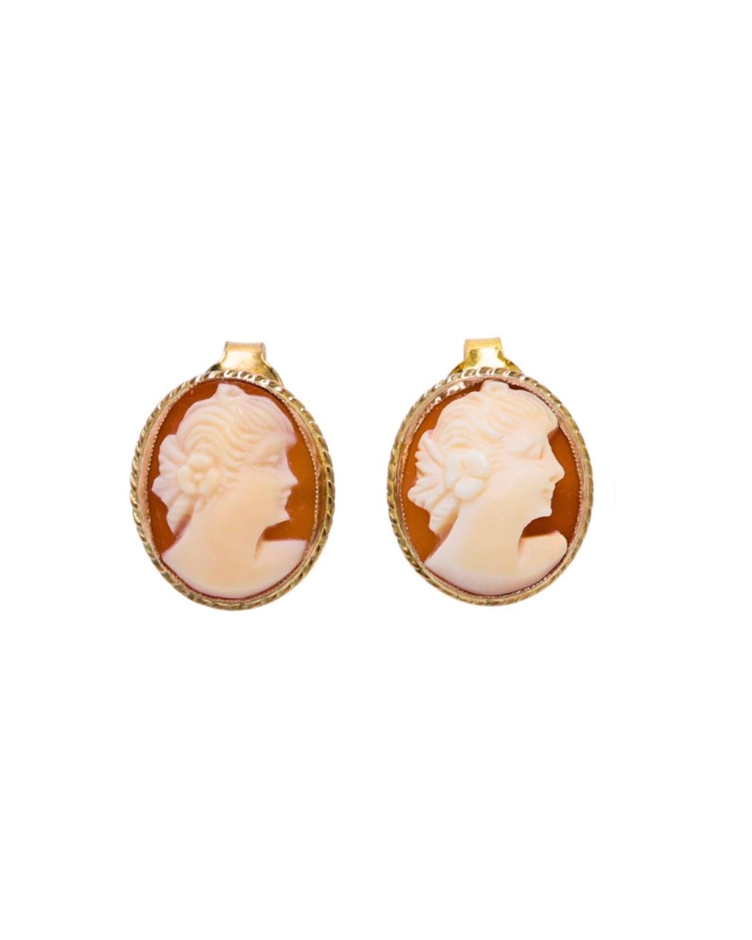A gold bar brooch featuring a central oval shell cameo of a profile portrait, attached to a safety pin by a thin chain.