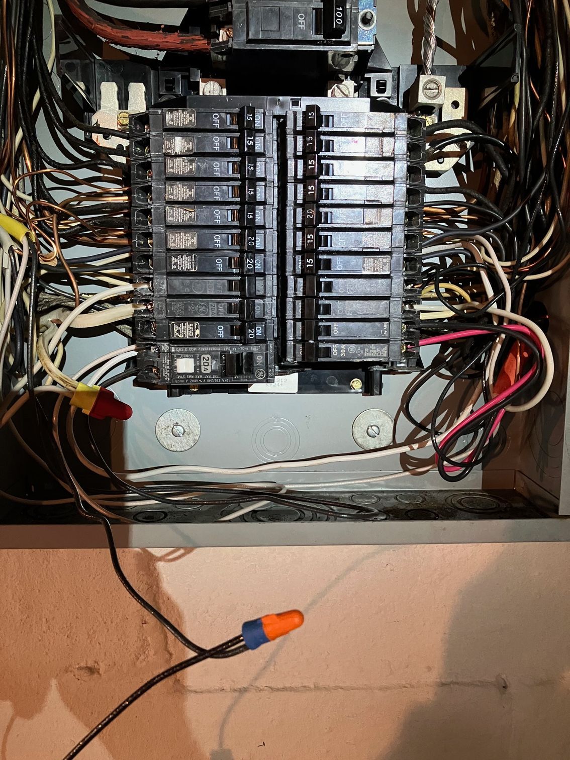 A electrical box with a lot of wires coming out of it
