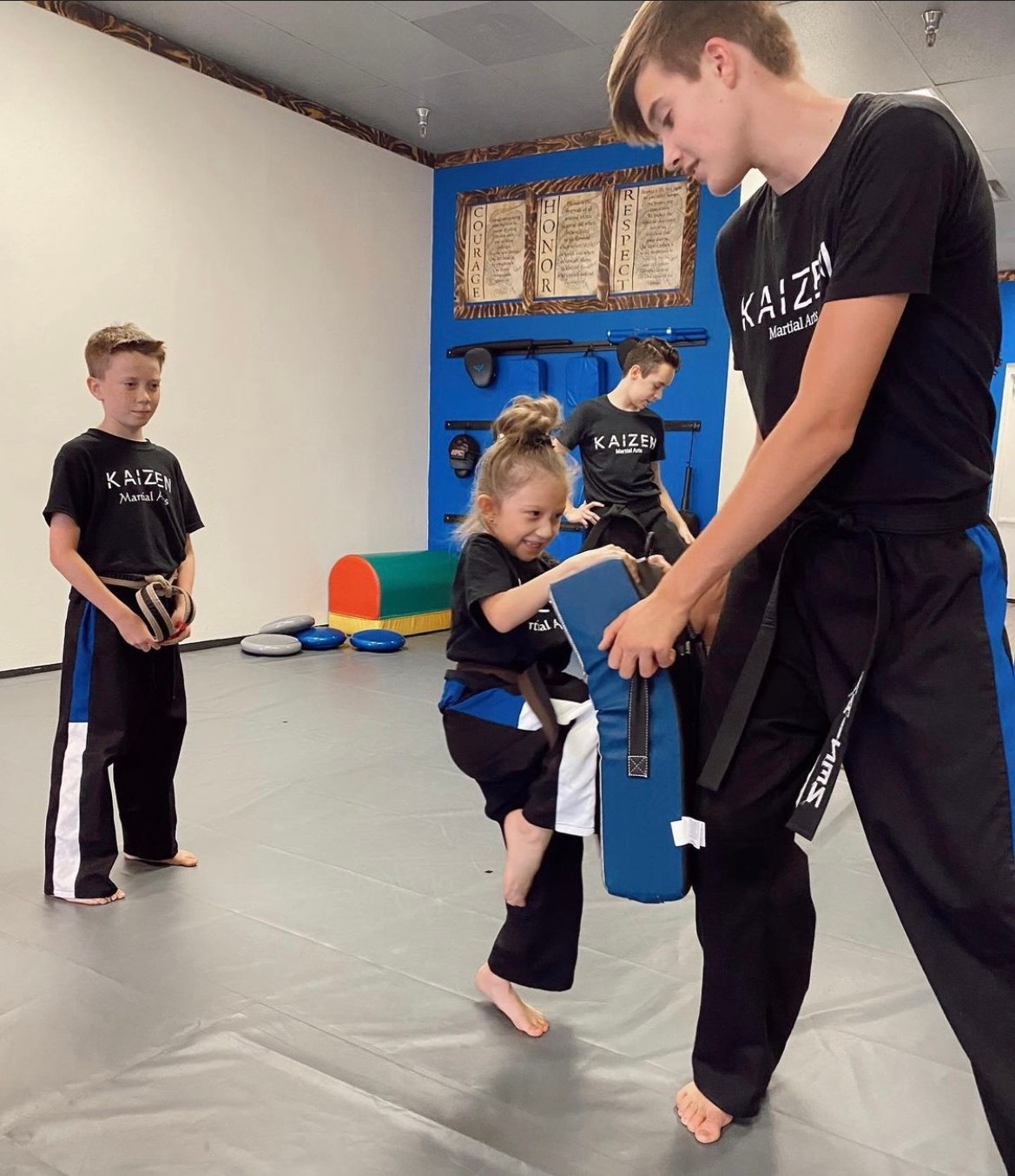 Children ages 4 to 6 following karate movements in a Lil' Dragons class at Kaizen Academy in Gilbert, AZ