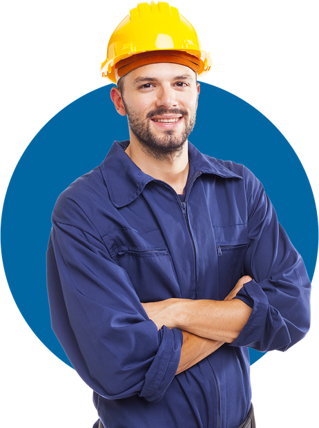 Worker in blue coveralls and yellow hard hat, standing with arms crossed against a blue background