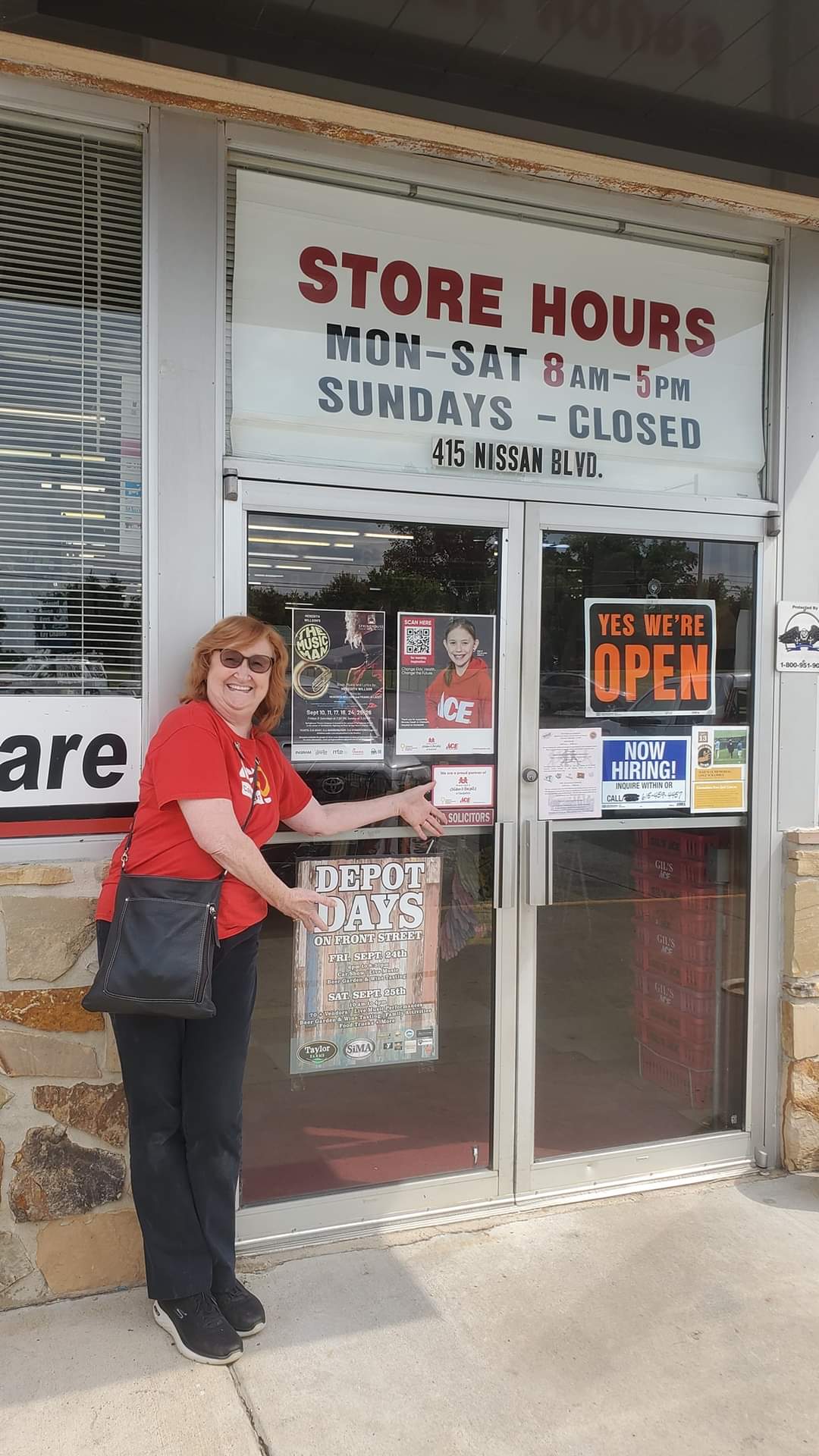 woman in front of depot days sign