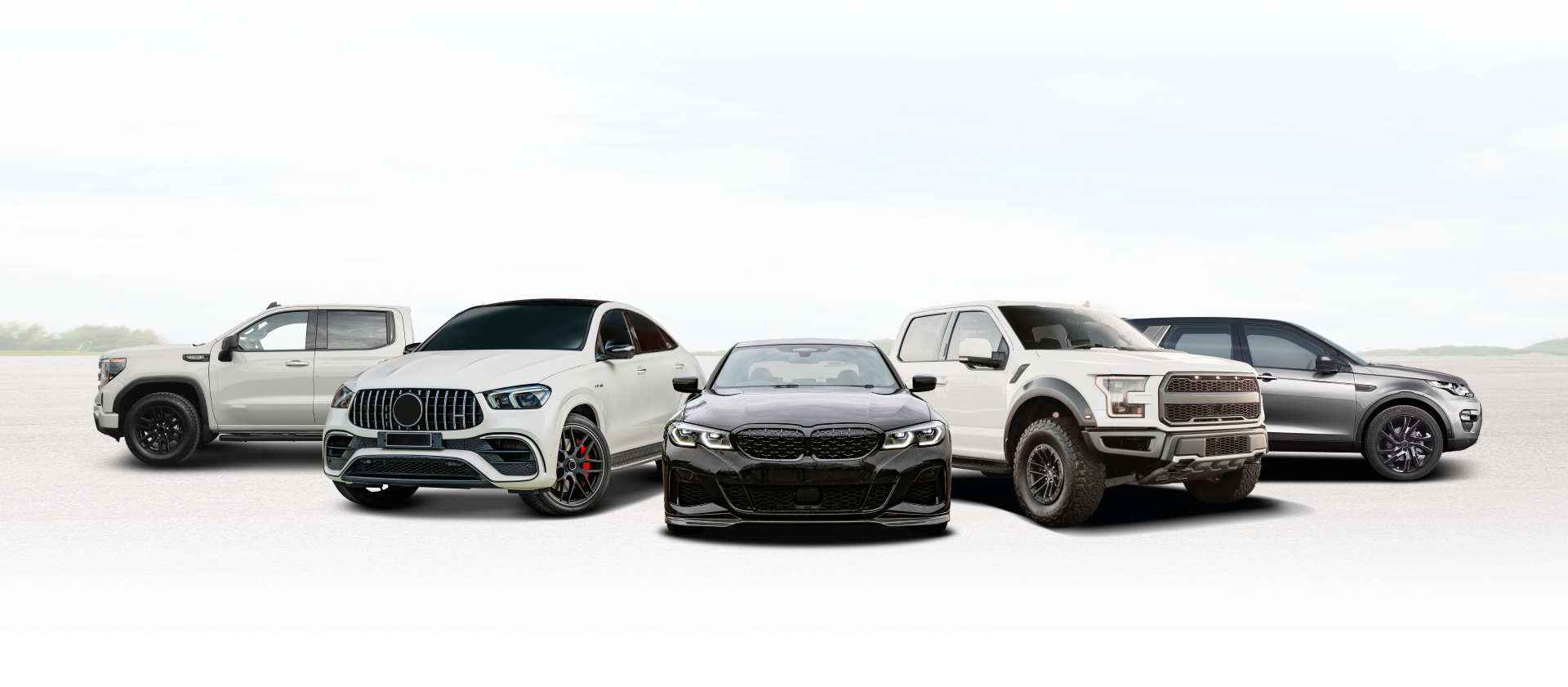 Four luxury SUVs and sedans lined up on a white background | E&R Automotive