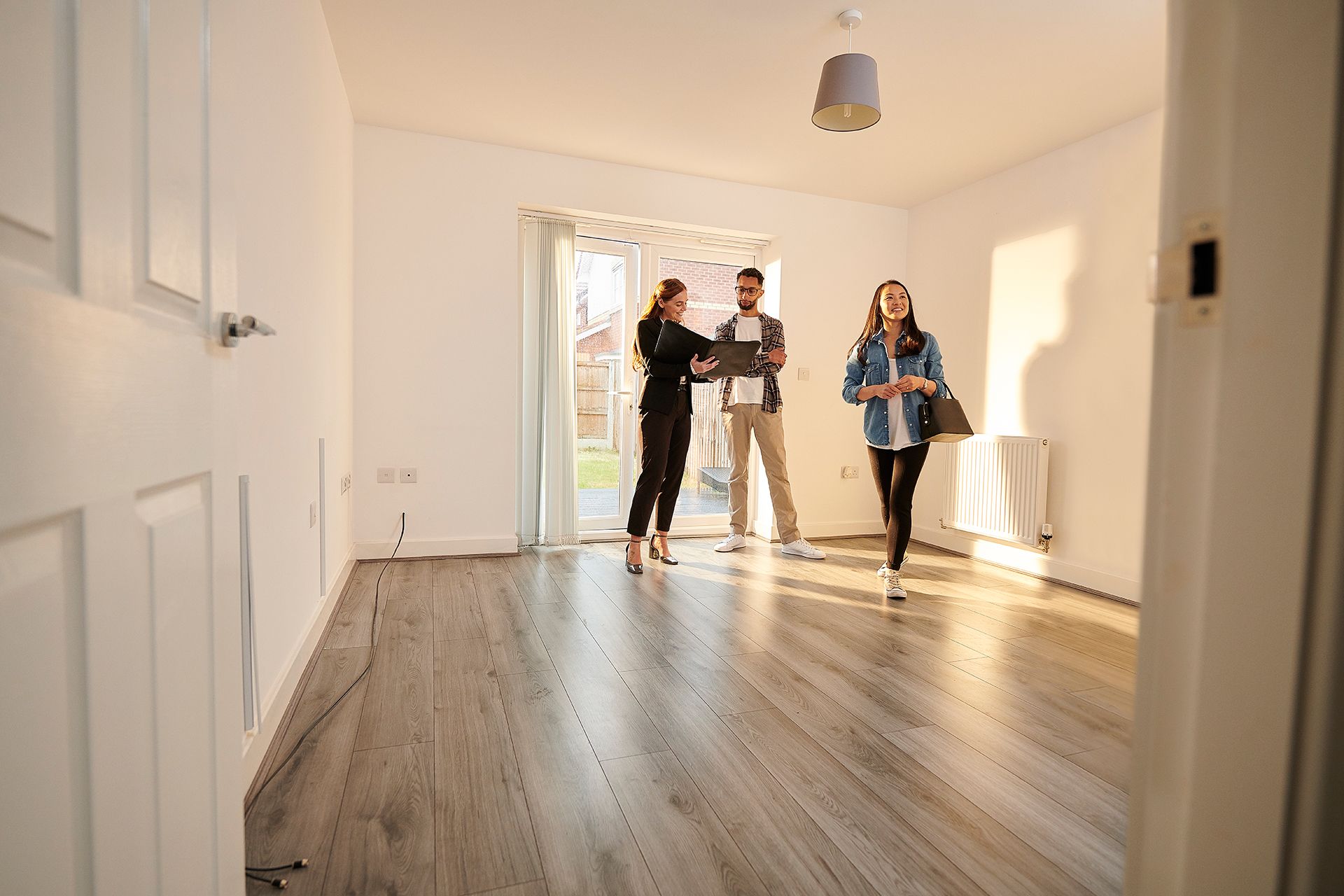 Photo of a happy couple signing a lease