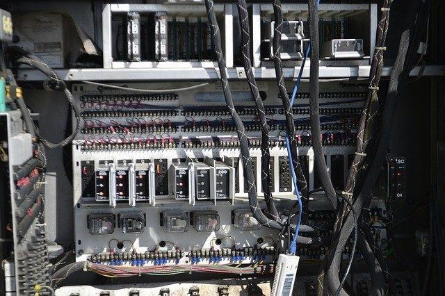 The inside of a computer with a lot of wires coming out of it