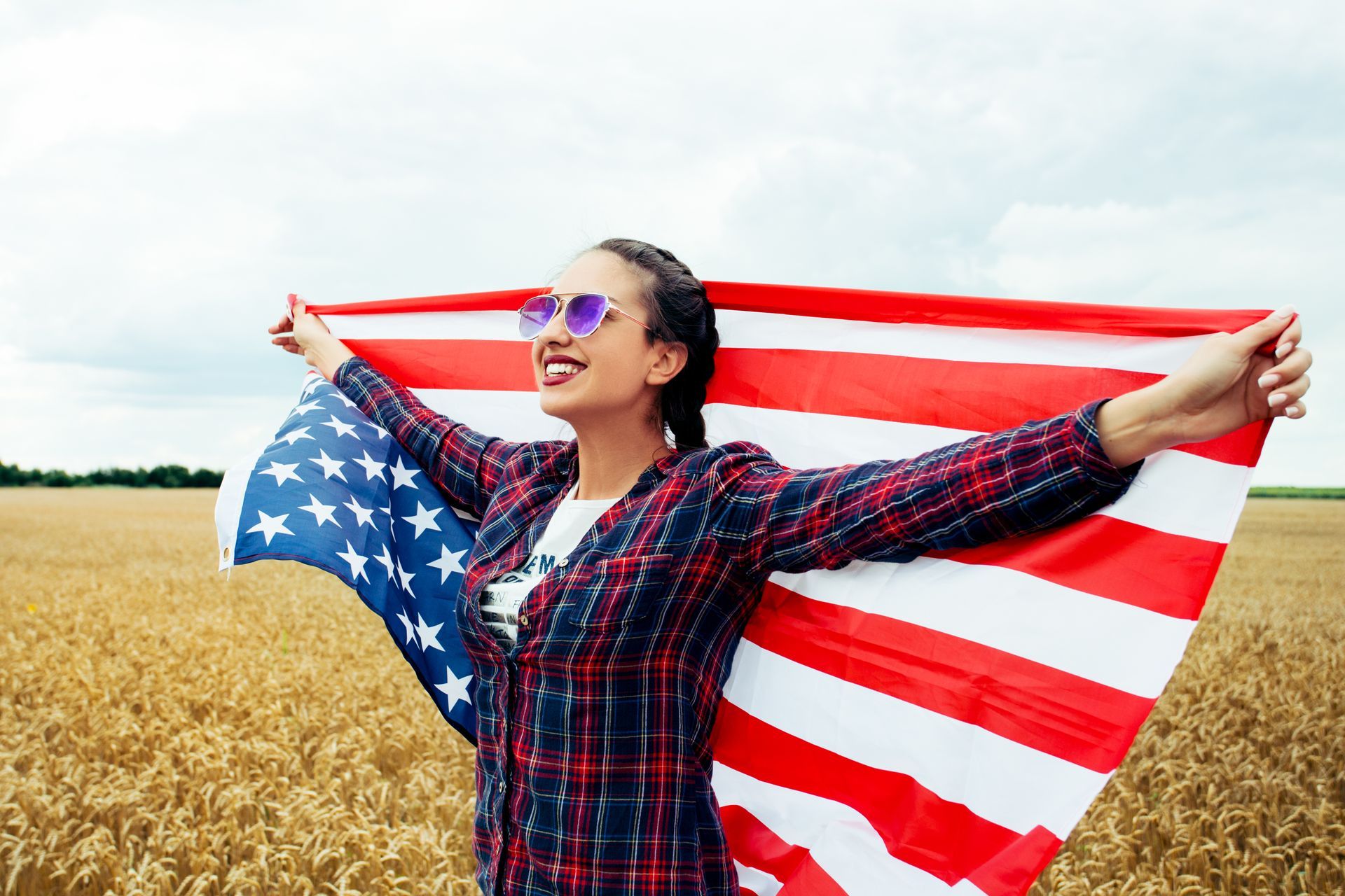 woman holding American flag woman holding American flag