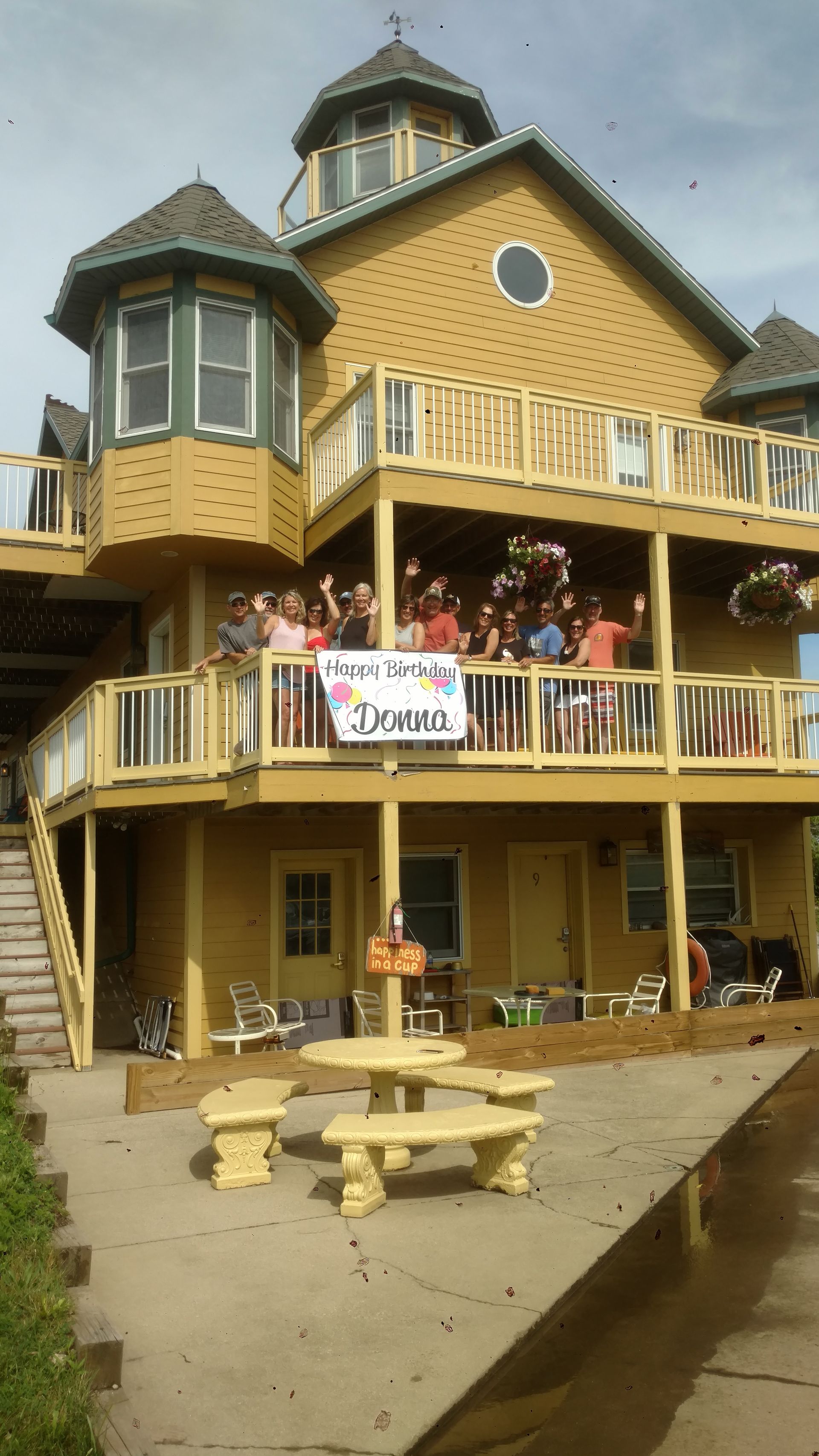 group-on-balcony-of-gold-house