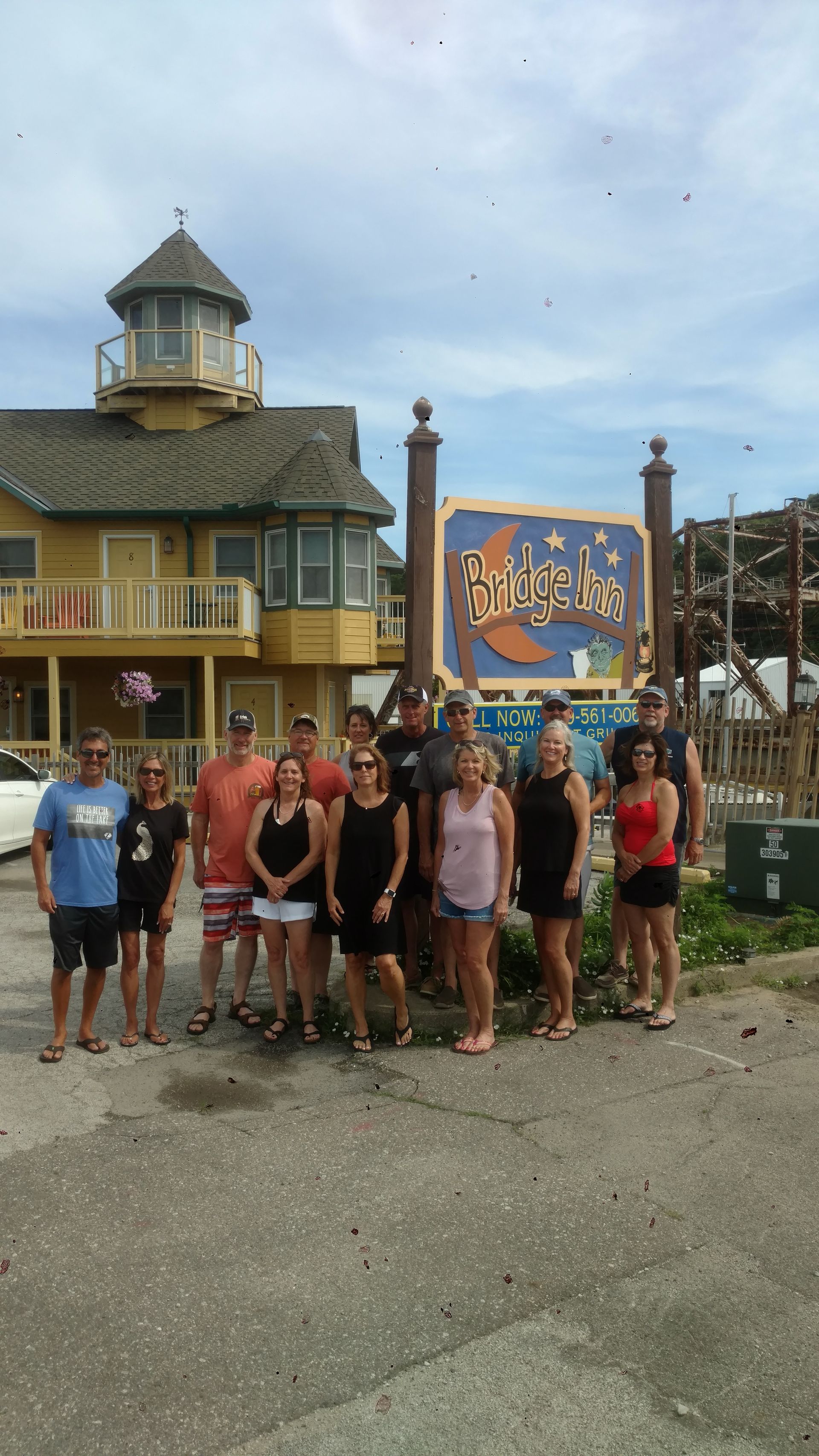 group-in-front-of-bridge-inn-sign