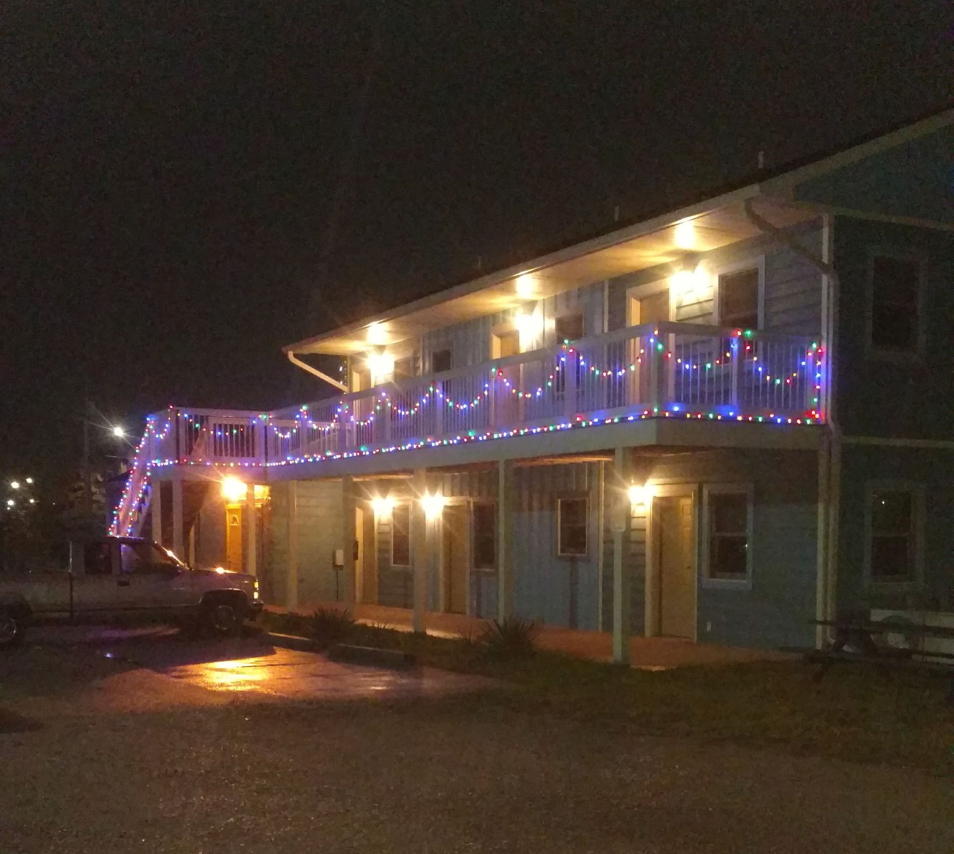 blue-house-with-christmas-lights