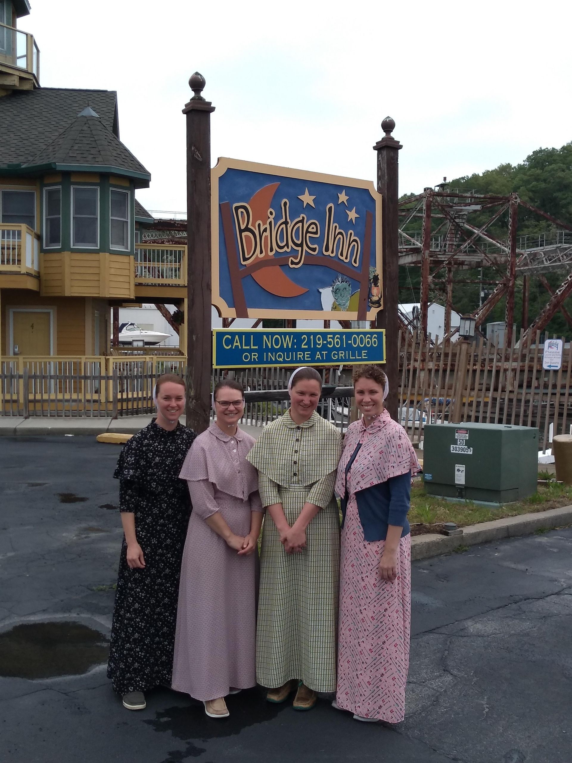 group-in-front-of-bridge-inn-sign