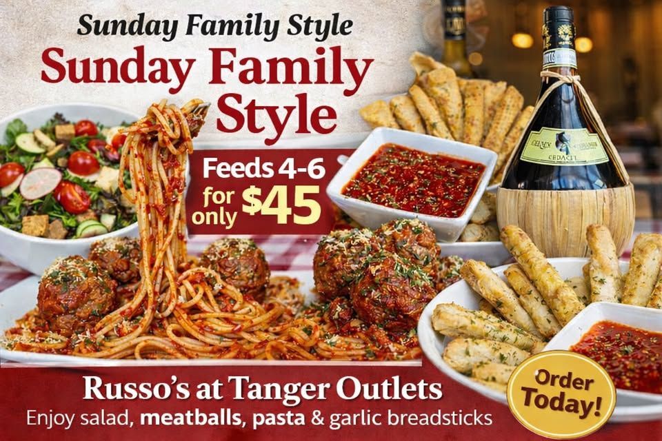 Russo's Sunday Family Style meal. Spaghetti, meatballs, salad, breadsticks, and a bottle of wine.