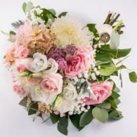 Pink and white floral bouquet with greenery on a white background