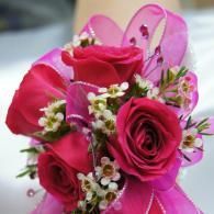 Pink rose bouquet with white baby’s breath and ribbon accents