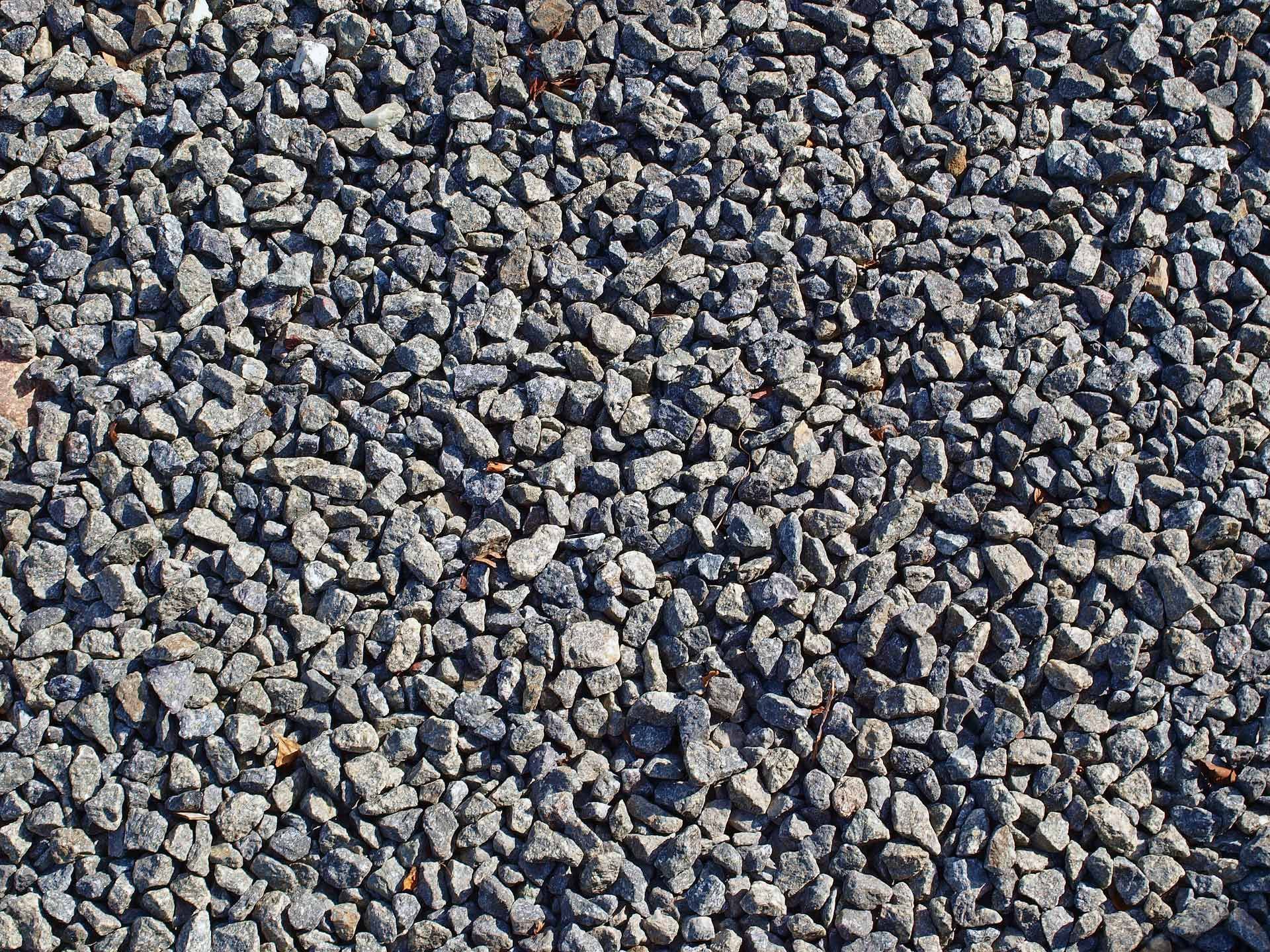Close-up of a pile of small, gray gravel stones