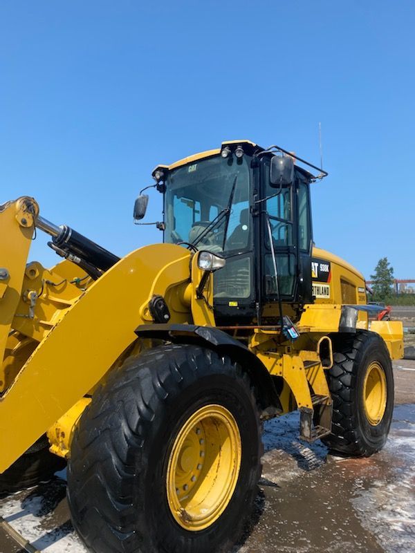A small yellow dump truck