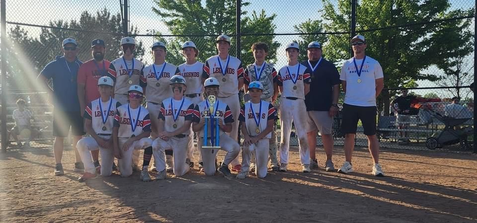 Legends Athletics baseball team holding a trophy