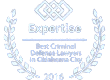 Blue award seal reading “Best Criminal Defense Lawyer” with laurel wreath border and annual date text