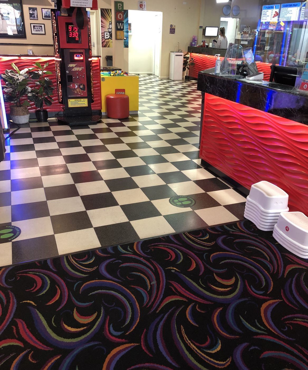 Clean checkered floor and carpet inside Wagga Bowl