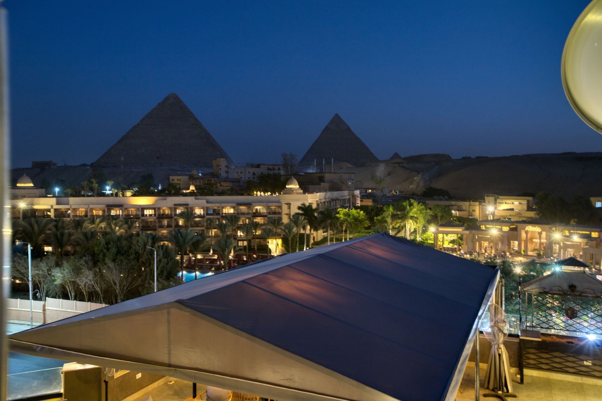 An aerial view of the pyramids at night