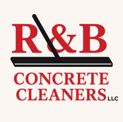 Silhouette of a person pressure washing concrete with