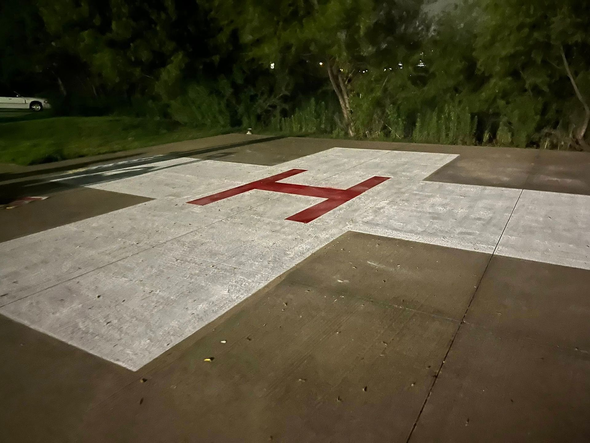 Helipad with white cross and red