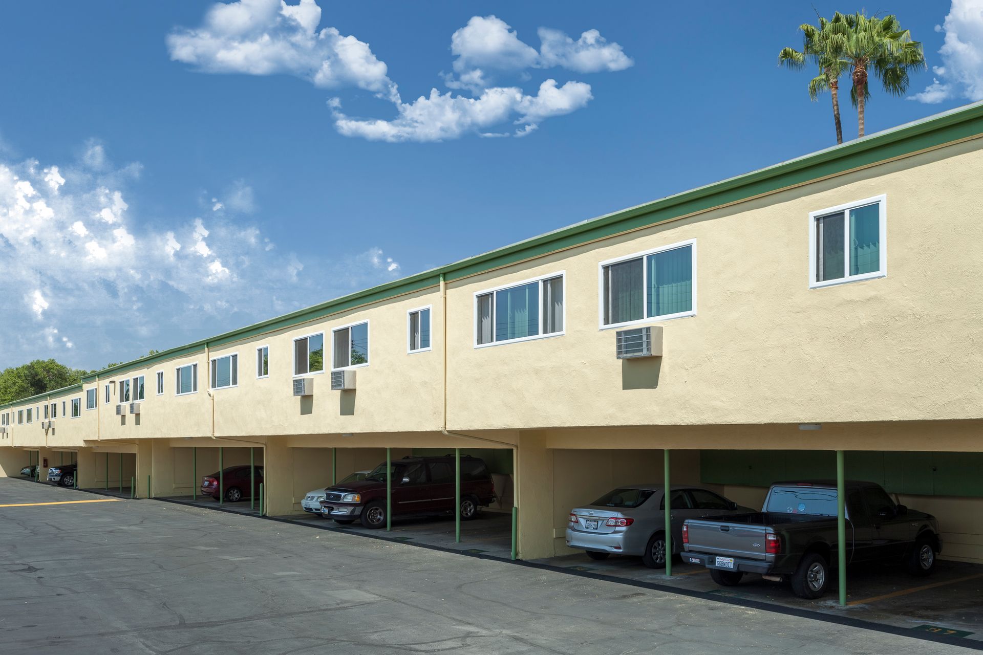 A building with a lot of cars parked in front of it