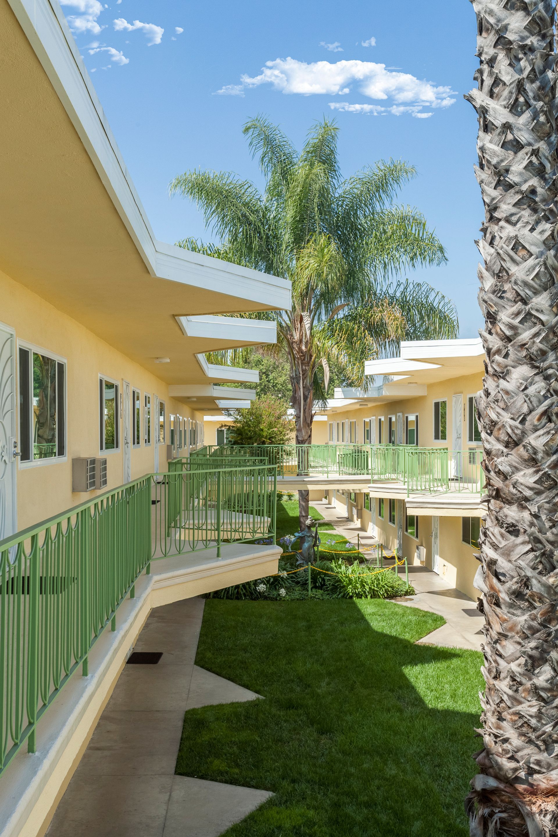 A building with a palm tree in the middle of it