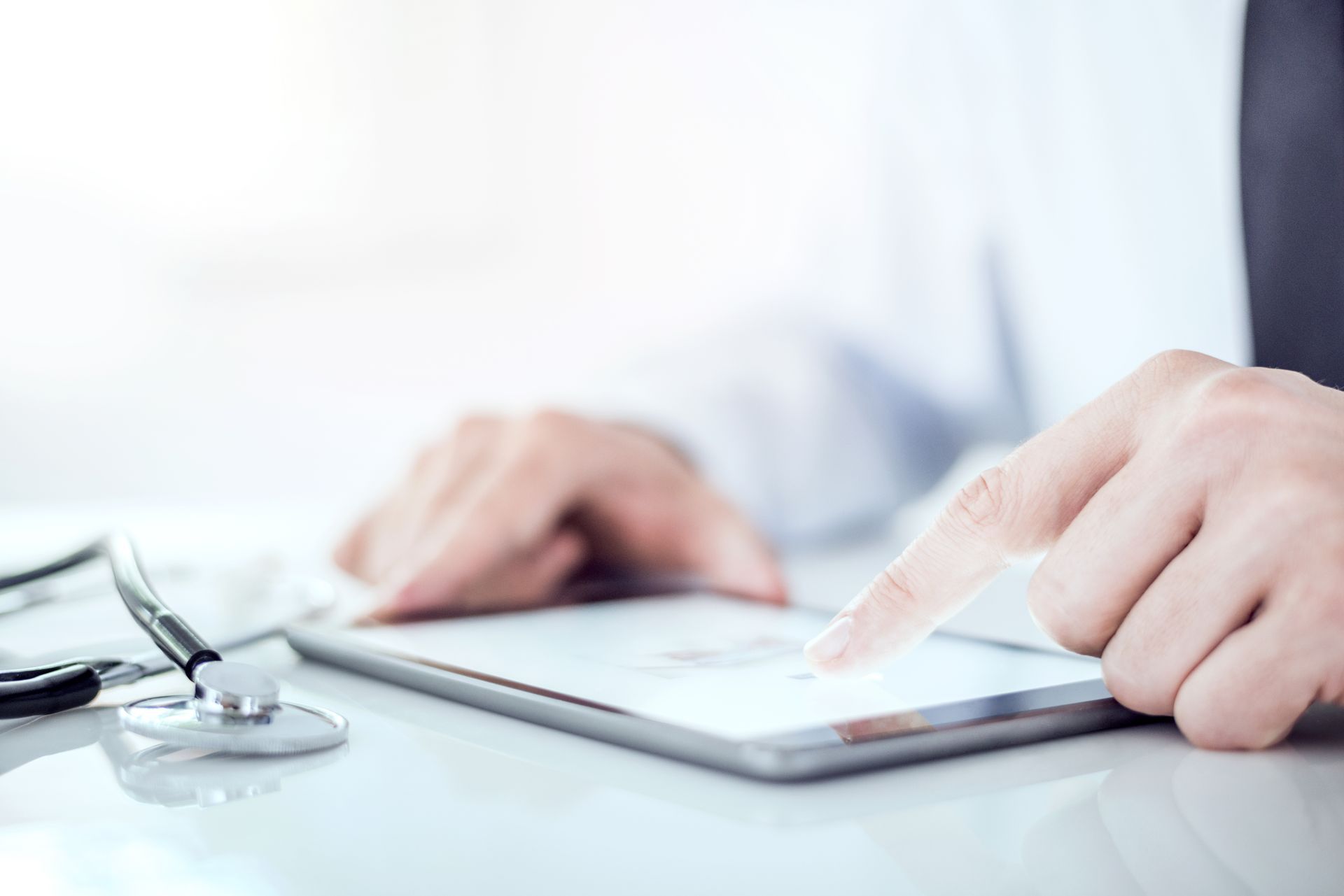A pharmacist browsing a tablet