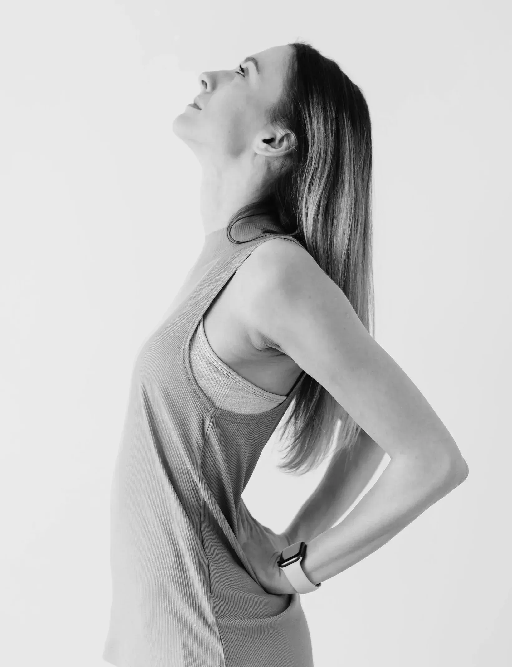 Woman in a sleeveless top in profile, hyperhidrosis treatment at ORION Dental near Southampton