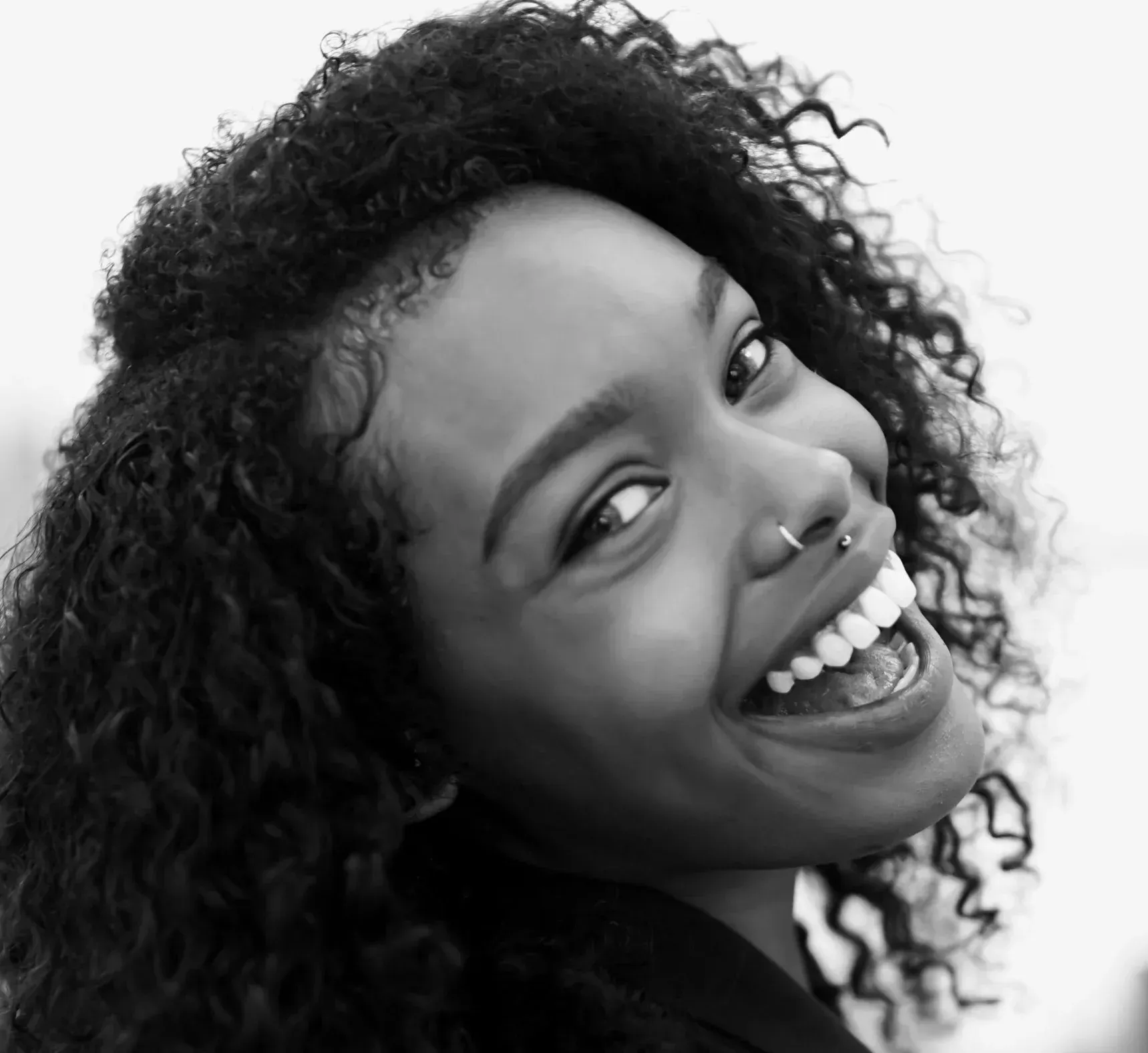 Joyful woman showing a bright, confident smile at a dentist near Southampton