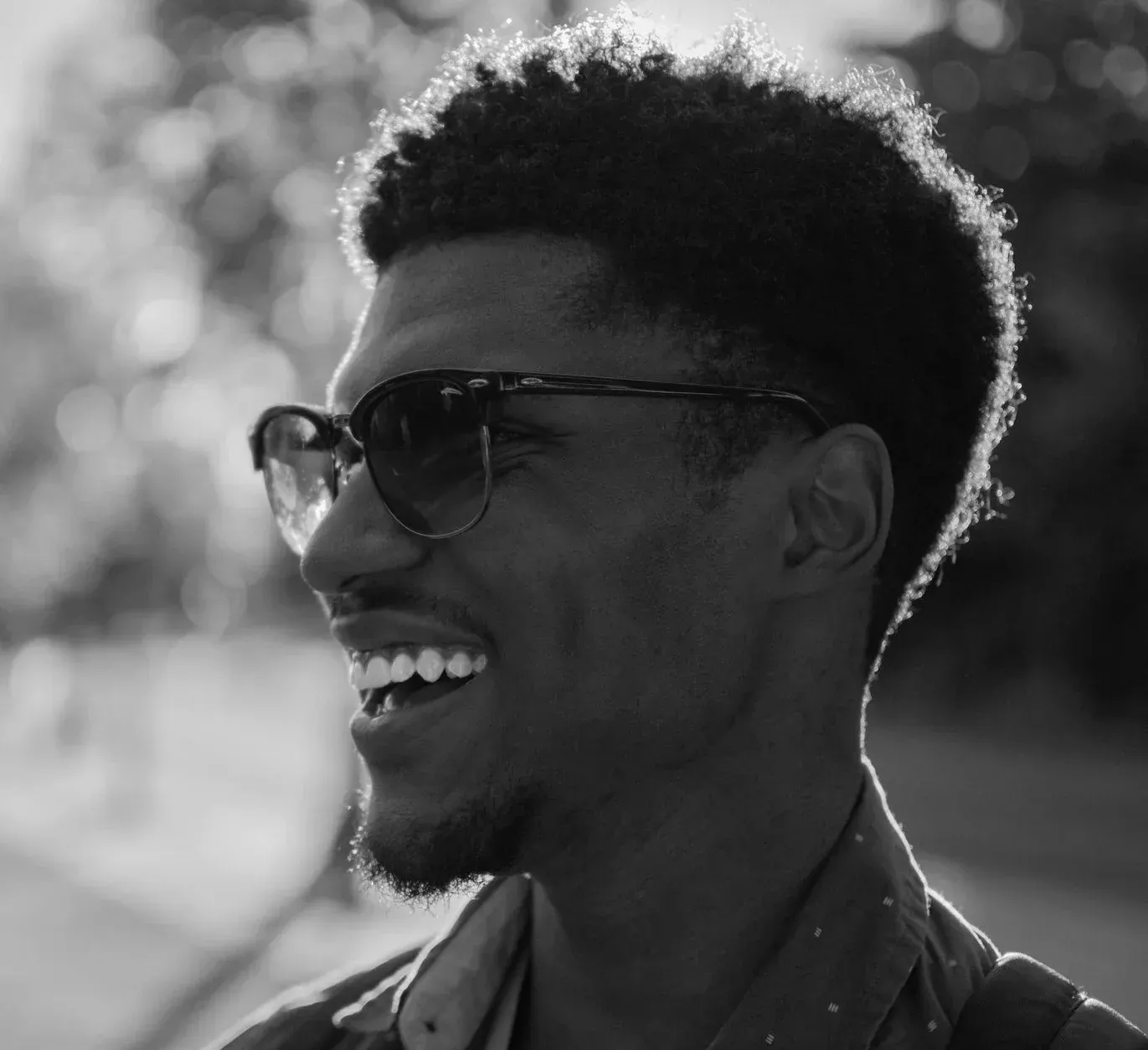 Young man with a bright smile outdoors after teeth whitening near Southampton
