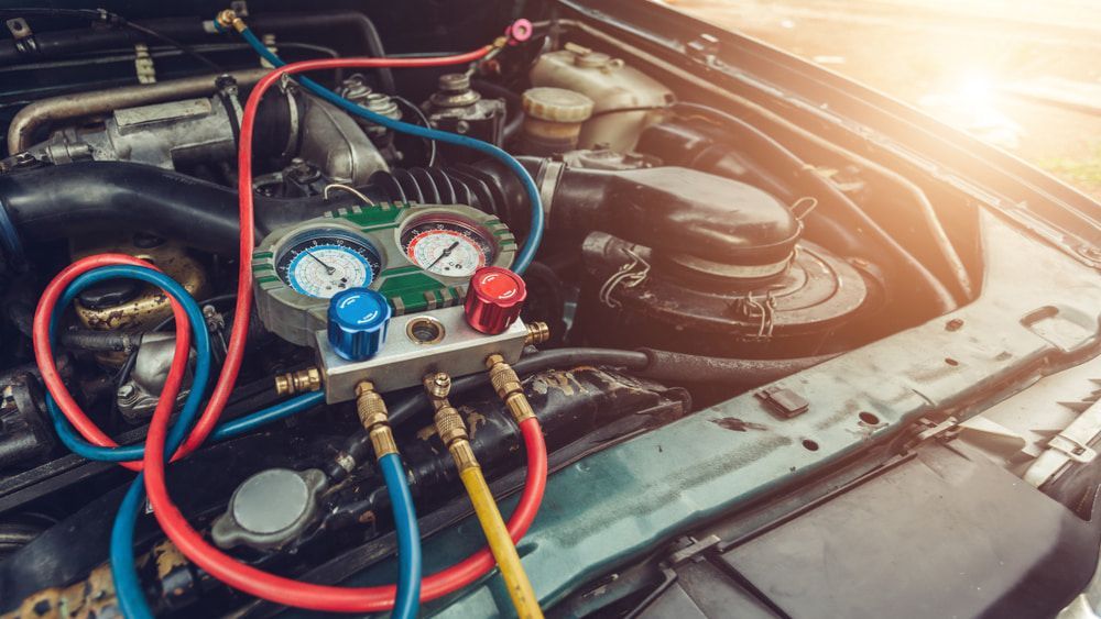 A Close Up Of A Car Engine With Hose Attached To It — Rainbow Beach Auto Electrics In Rainbow Beach, QLD